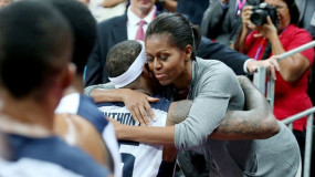 First Lady Michelle Obama Hugs Sweaty Team USA Players After Beating France